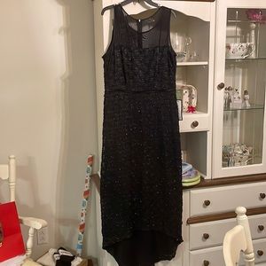 Black connected apparel beaded evening gown size 12 .